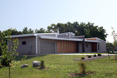Example of a small urban one-story mixed siding exterior home design in Other