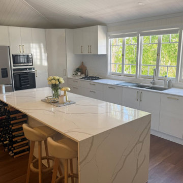 Grand Calacatta Stone Benchtop | Waterfall Kitchen Island
