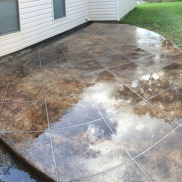 Acid stained concrete scored in tile pattern
