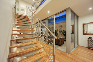 Contemporary wood straight staircase in Perth with open risers.