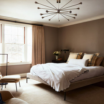 Primary Bedroom with Womb Chairs and Modern Lighting