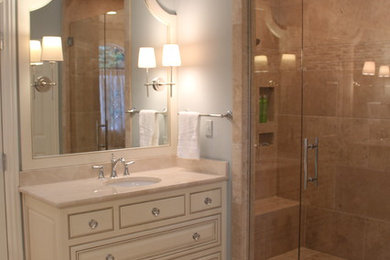 Example of a mid-sized classic master travertine floor bathroom design in Other with blue walls