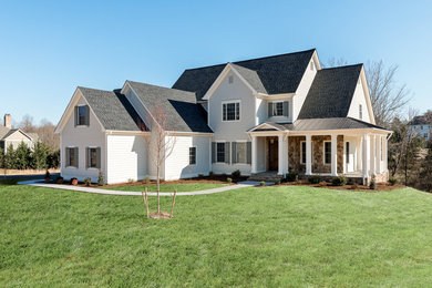 Example of a large arts and crafts gray two-story mixed siding exterior home design in Other with a mixed material roof