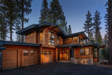 Example of a large trendy brown two-story wood exterior home design in Sacramento with a metal roof