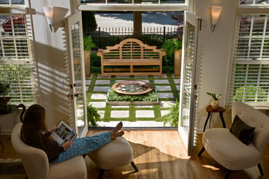 Design ideas for a small contemporary partial sun front yard stone and metal fence landscaping in Chicago for summer.