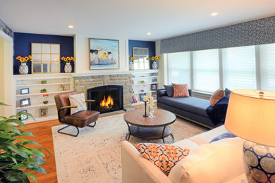 Living room - farmhouse light wood floor living room idea in Newark with blue walls, a standard fireplace and a wood fireplace surround