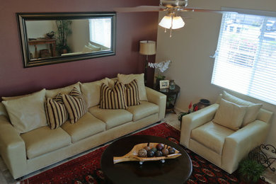 Example of a mid-sized eclectic open concept living room design in Phoenix with red walls