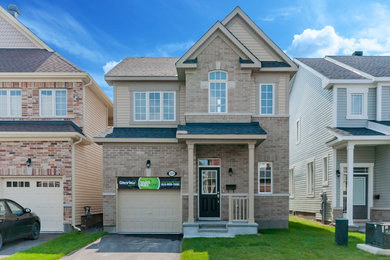 Example of a classic exterior home design in Ottawa