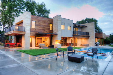 Example of a large trendy two-story mixed siding exterior home design in Denver with a mixed material roof