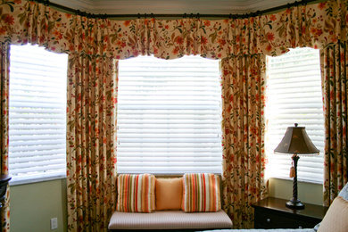 Example of a transitional bedroom design in Miami