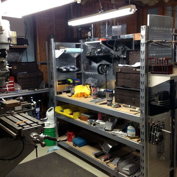 Some old industrial shelving has been converted to a nice workstation with the u