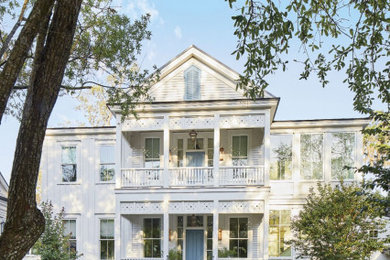 Beach style white two-story exterior home photo in Toronto
