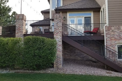 Inspiration for a mid-sized timeless backyard deck remodel in Denver with no cover