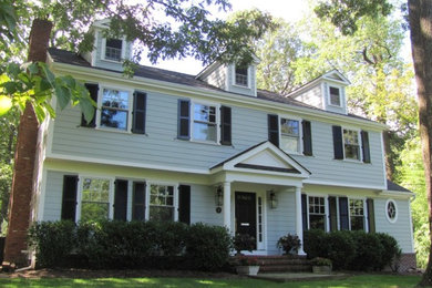 Mid-sized traditional gray two-story concrete fiberboard exterior home idea in New York