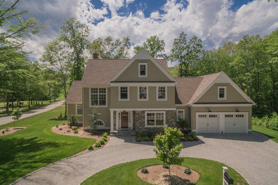 Mid-sized traditional beige two-story mixed siding and shingle exterior home idea in Bridgeport with a shingle roof and a brown roof
