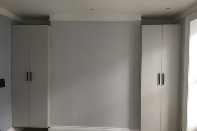 Photo of a medium sized modern master bedroom in London.