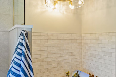Inspiration for a mid-sized contemporary master porcelain tile and double-sink bathroom remodel in Other with shaker cabinets, blue cabinets, beige walls, an undermount sink, quartz countertops and a built-in vanity
