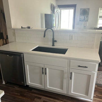 Kitchen Remodel with White Refaced Cabinets and Quartz Tops