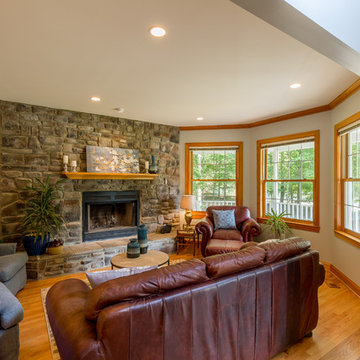 Living room remodel with stone fireplace.