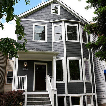 Modern Two-Story Home with Gray Siding and White Accents