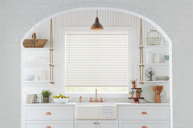 Example of a transitional kitchen design in New York