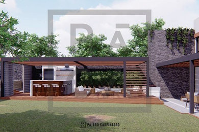 Foto de terraza actual extra grande en patio trasero con cocina exterior y pérgola