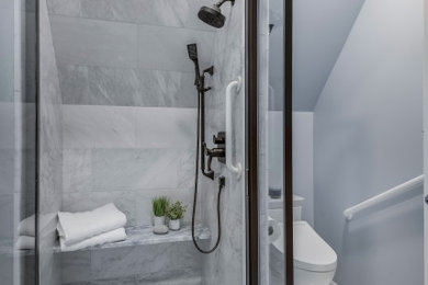 Transitional marble tile bathroom photo in Minneapolis with a hinged shower door and blue walls