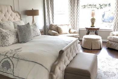 Mid-sized elegant master dark wood floor and brown floor bedroom photo in Houston with gray walls