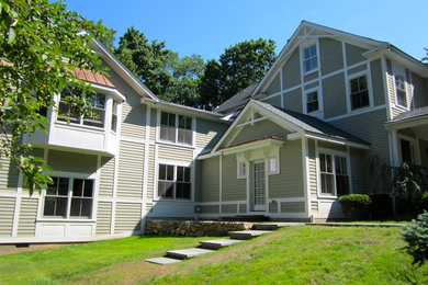 Example of a farmhouse exterior home design in New York
