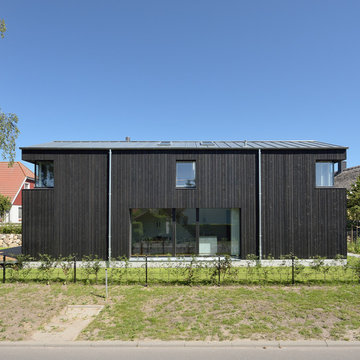 Minimalistisches Ferienhauses in Anlehnung an ein traditionelles Drempelhaus