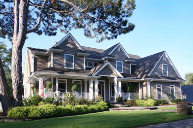 Design ideas for a large traditional two-storey exterior in Philadelphia with vinyl siding.