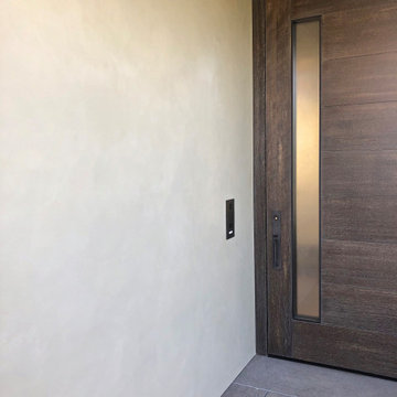 Color Atelier Lime Paint in color Chevre on exterior walls.