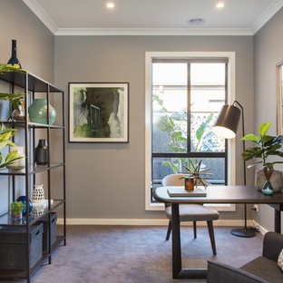 Design ideas for a contemporary study room in Melbourne with grey walls, carpet, a freestanding desk and grey floor.