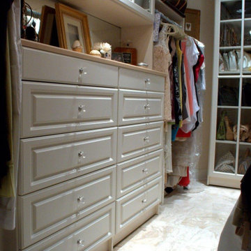 Beautiful Walk-in with Raised Panel Drawers and Glass Knobs