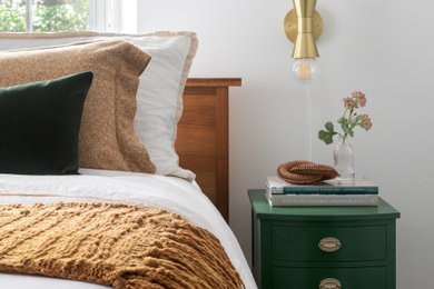 Inspiration for a small eclectic master dark wood floor, brown floor and vaulted ceiling bedroom remodel in Philadelphia with white walls