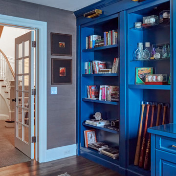 Hidden Door Behind Blue Bookcase