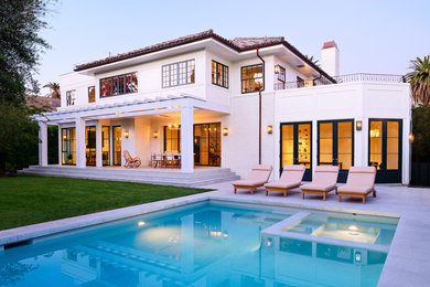 Inspiration for a large transitional white two-story mixed siding gable roof remodel in Los Angeles