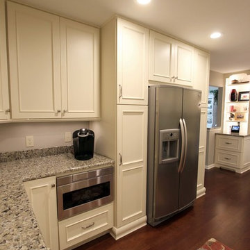 Medallion Painted White Chocolate Kitchen Cabinets with Petal Mosaic Backsplash