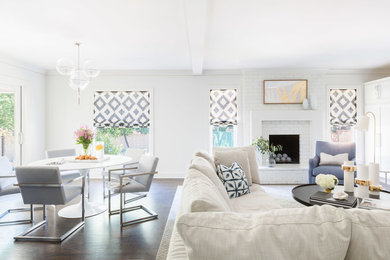 Example of a mid-sized minimalist open concept dark wood floor living room design in Other with white walls, a standard fireplace and a brick fireplace