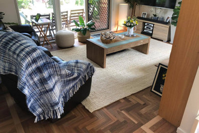 Inspiration for a modern enclosed living room in Melbourne with dark hardwood floors.