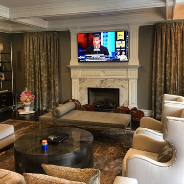 Family room with tv over fireplace and Dropdown projection screen