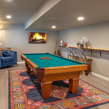 Basement Utilizing Open Space to Shoot Pool and Watch Favorite Sports Team