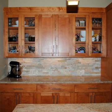 Stacked Stone Tile Backsplash and Millennium Cream Granite