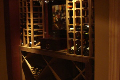 Small tuscan ceramic tile wine cellar photo in Salt Lake City