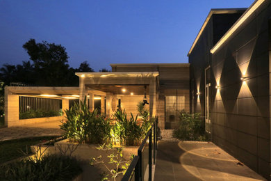 Design ideas for a contemporary partial sun backyard concrete paver and metal fence landscaping in Dallas.