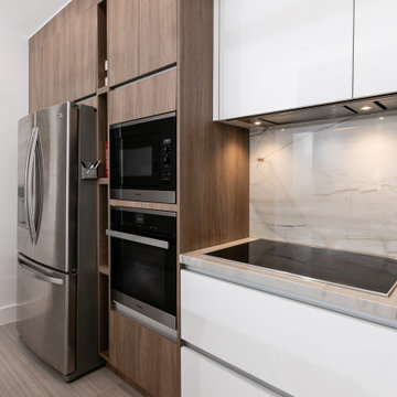Built-in Appliances and Sleek Design in Urban Coffee Kitchen