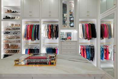 Inspiration for a large transitional gender-neutral carpeted and beige floor walk-in closet remodel in Dallas with beaded inset cabinets and white cabinets