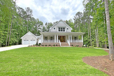Example of a cottage exterior home design in Raleigh