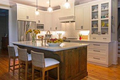 This is an example of a traditional kitchen in Other with with island.