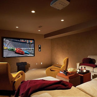 Inspiration for a medium sized modern enclosed home cinema in Louisville with brown walls, carpet and a wall mounted tv.